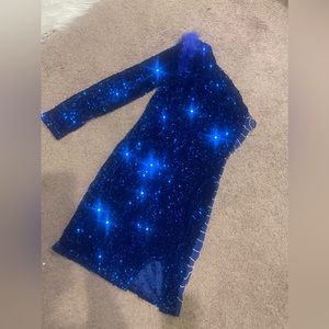 Blue Sequin dress with rhinestone on the side .